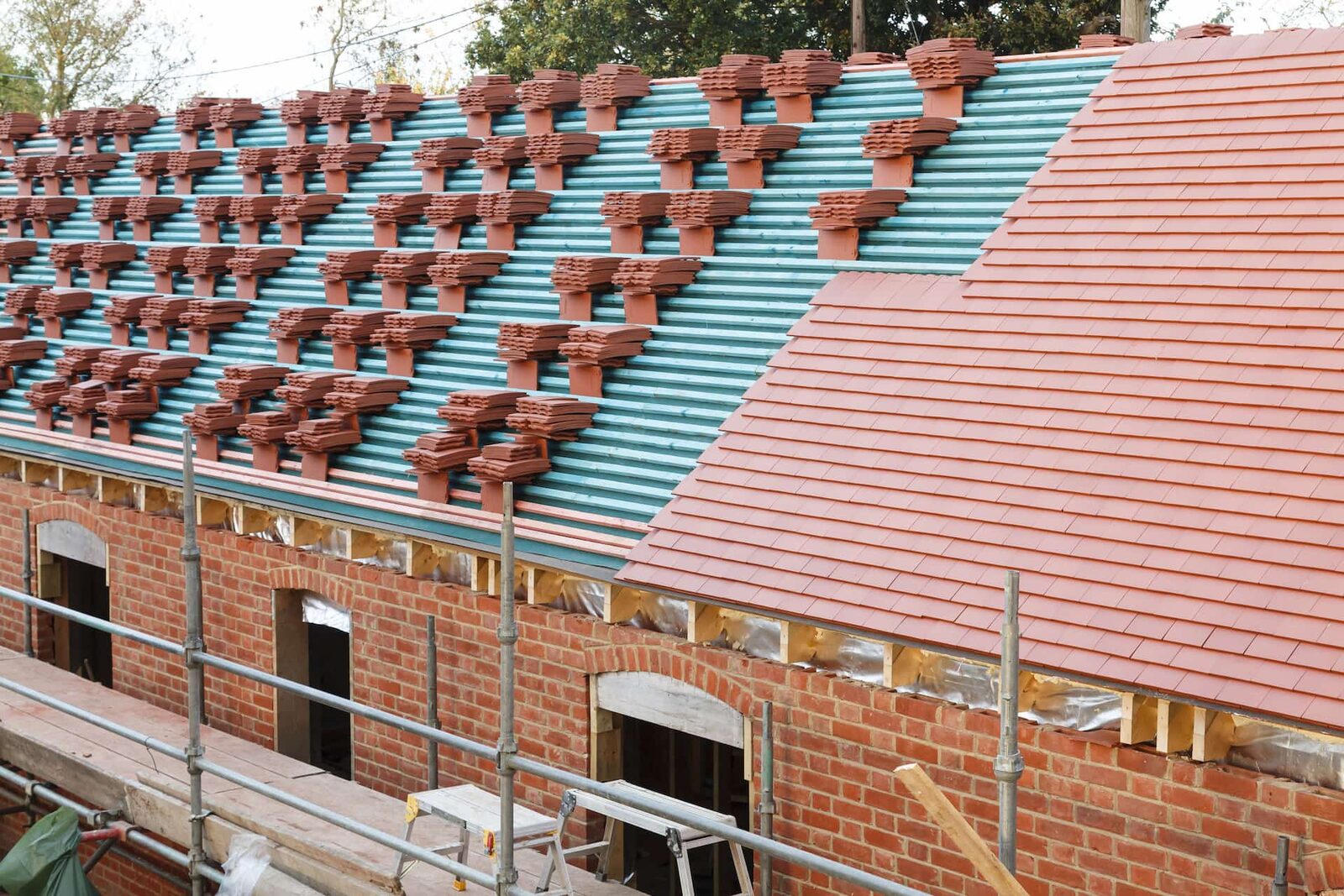 Professional roofer working on a pitched tiled roof